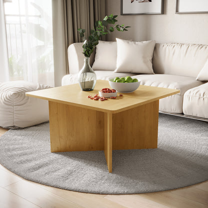 Emelia 80cm Square Coffee Table Oak displayed in a stylish living room, showcasing its modern square shape on a floor beside a couch, enhancing the space with its elegant design.