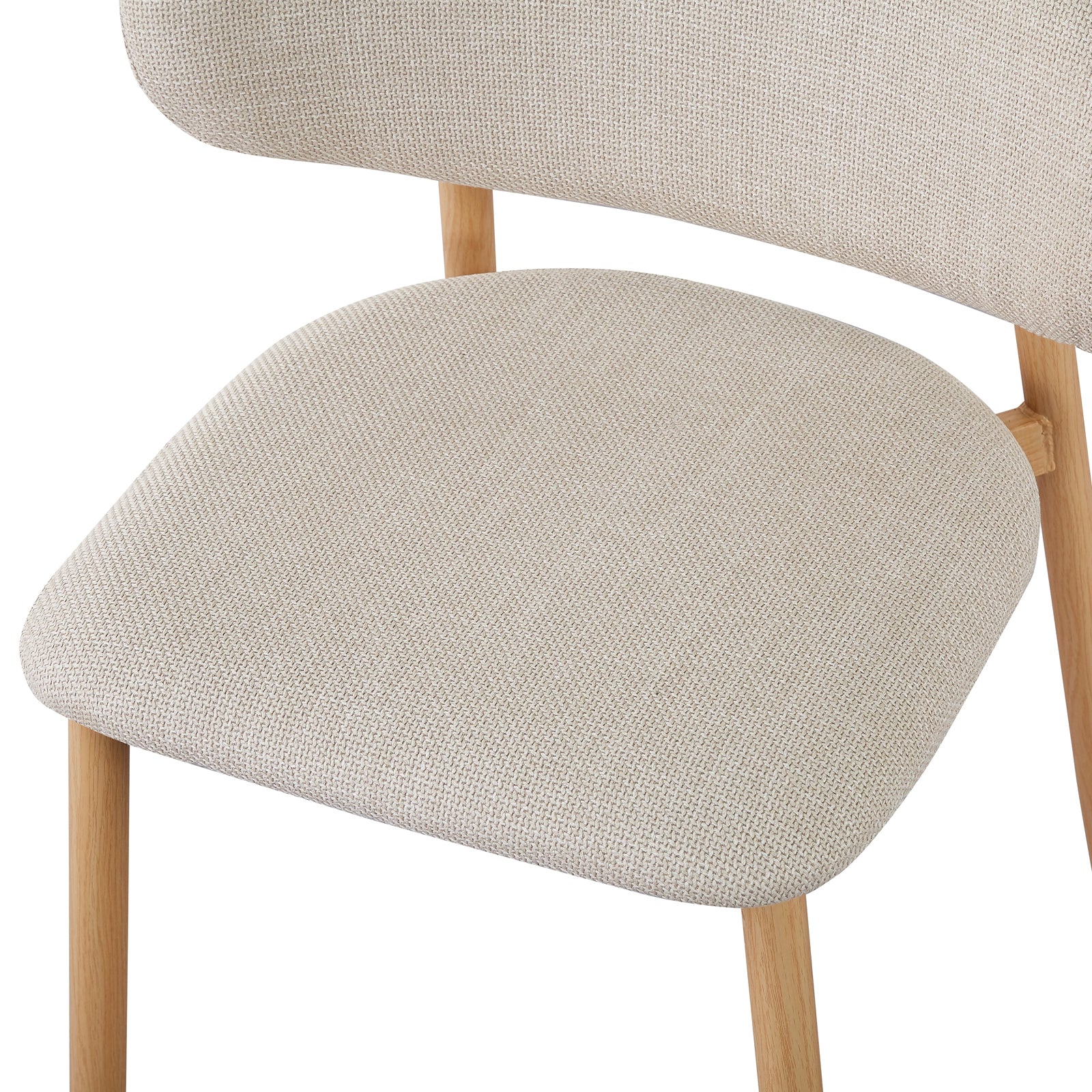 Close-up of an Audrey dining chair from the Enid Round Table with 4 Audrey Dining Chair Set - Beige, showcasing wicker armrest, linen fabric upholstery, foam padding, and sleek wood-feel metal legs.