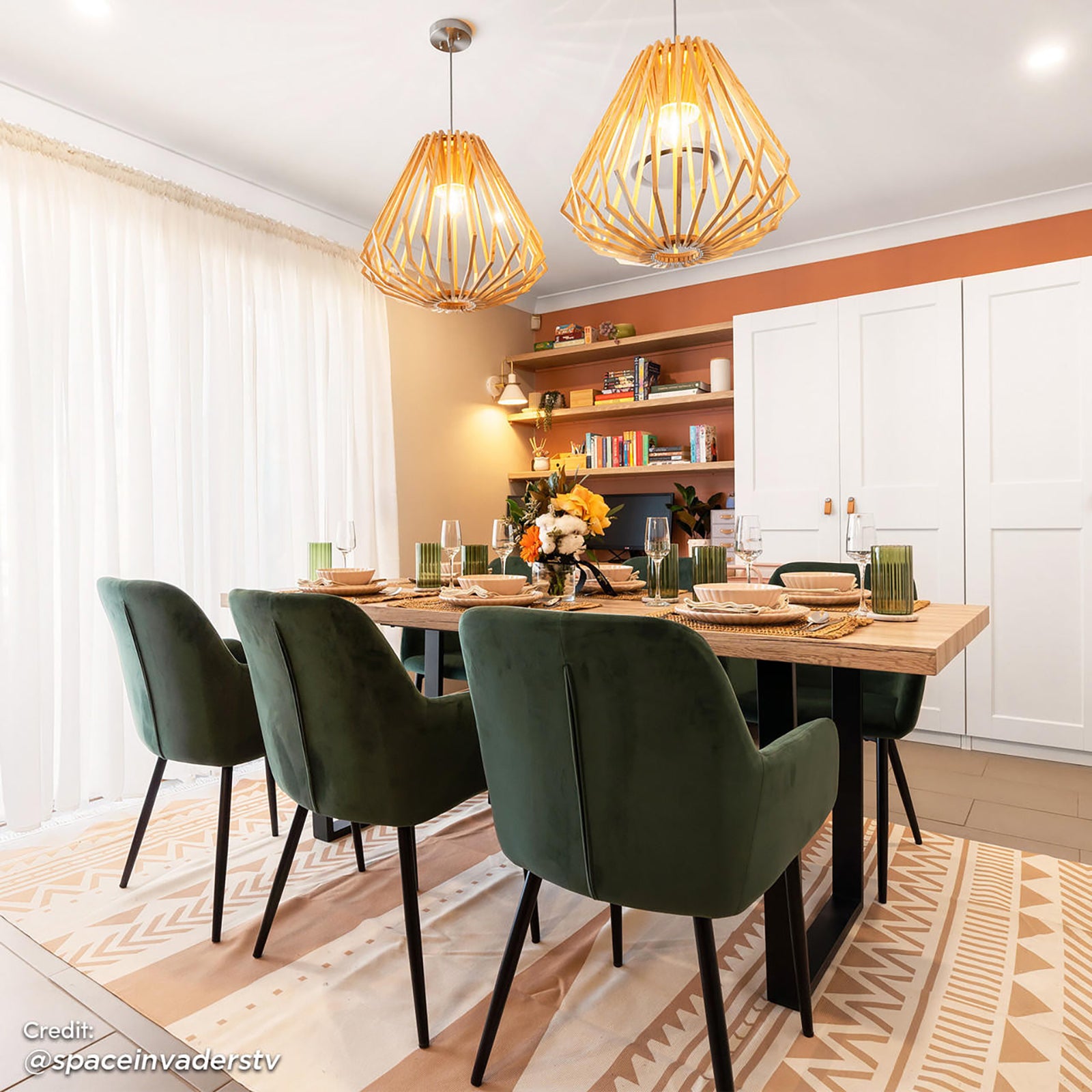 Ernest 200cm 6 Seater Industrial Dining Table in Natural, featuring a reclaimed-look tabletop, U-shaped black metal legs, and set with modern dining elements like woven placemats and elegant dinnerware.