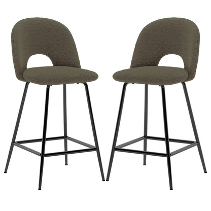Evie Boucle Bar Stool Set of 2 in Green features rounded seats with low backs, arched openings, black metal legs, and footrest. Ideal for kitchen islands or bar areas.