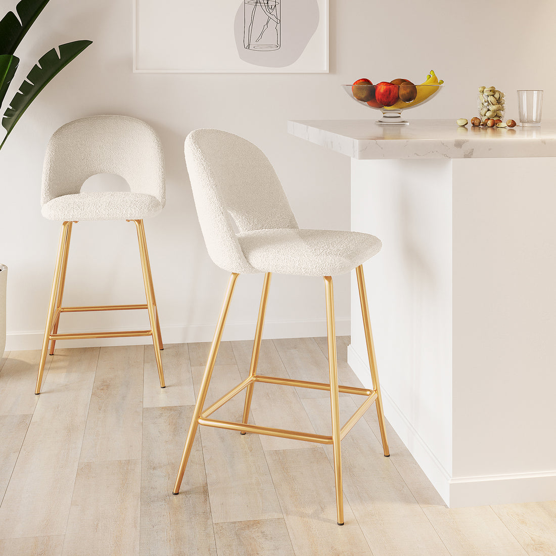Evie High Back Boucle Bar Stool Set of 2 in White; featuring off-white boucle seats and slim gold legs against a modern kitchen island, accented with fruit and minimalist decor.