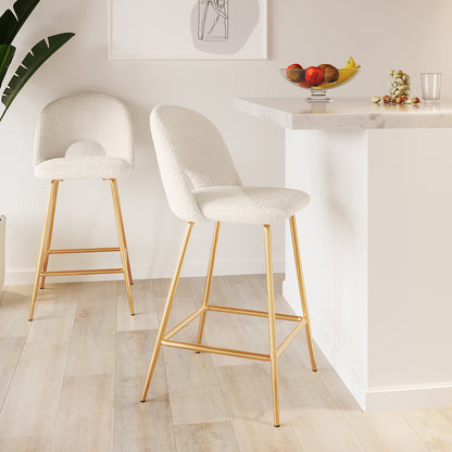 Evie High Back Boucle Bar Stool Set of 2 in White; featuring off-white boucle seats and slim gold legs against a modern kitchen island, accented with fruit and minimalist decor.