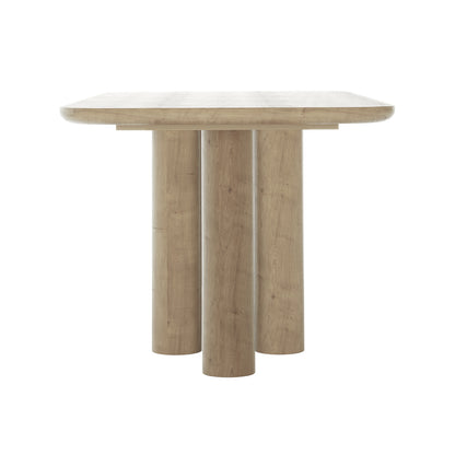 Faunus 200cm 8 Seater Dining Table in Natural, featuring a thick, rounded square top on central cylindrical pedestal legs, showcasing a minimalist design with a light oak finish.