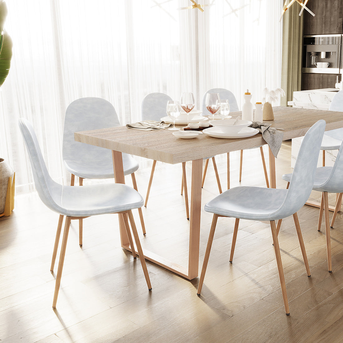 Florida PU Leather Dining Chairs Set of 4 in Slate, featuring sleek light-upholstered seats with slim wooden legs, elegantly surround a modern light-wood dining table set in an airy, minimalist dining area.