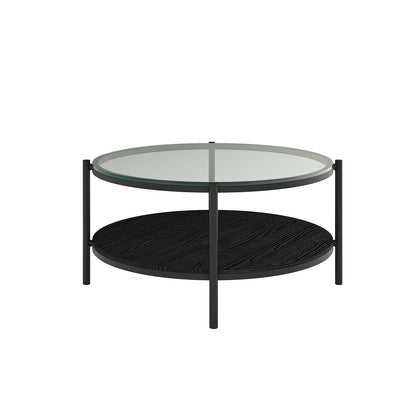 Frances 80cm Round Tempered Glass Coffee Table in Black, featuring a clear glass top, slim black metal legs, and a lower black-wood textured shelf for storage or display.