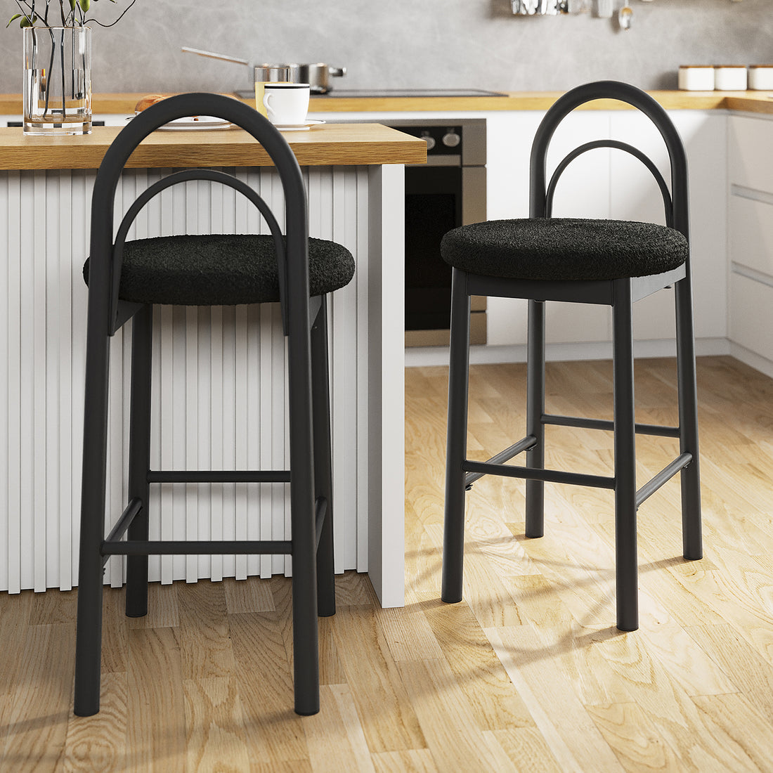 Gilles Boucle Arched Bar Stool Black Set of 2, featuring elegant boucle upholstery and arched backrest for comfort, on sleek metal frames with built-in footrests, perfect for modern kitchen settings.