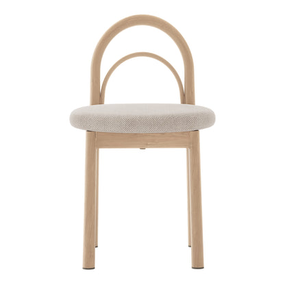 Close-up of the Gilles Linen Arched Dining Chair set, showcasing the elegant arched backrest and plush beige linen upholstery, highlighting its sophisticated design and comfort-focused construction.