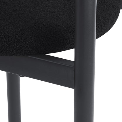 Gilles Boucle Arched Dining Chair Black Set of 2, featuring a sleek double-arched backrest and upholstered seats in luxurious boucle fabric, supported by a sturdy powder-coated metal frame.