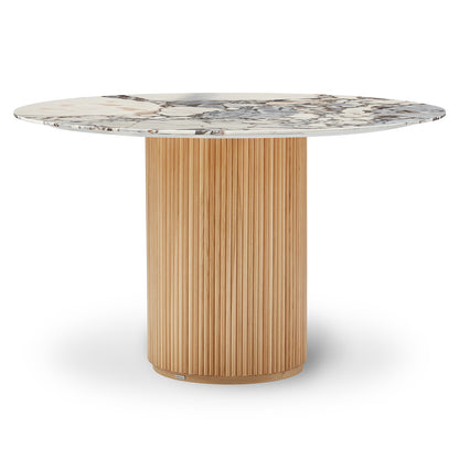 Gracie 120cm Round Marble Dining Table in Natural Blue Galaxy with a veined marble top and cylindrical wooden pedestal base of vertical slats, exuding luxury and stability for dining spaces.