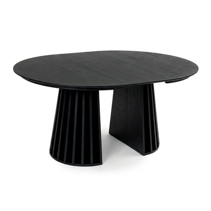 Modern black round dining table with slatted base on a white background
