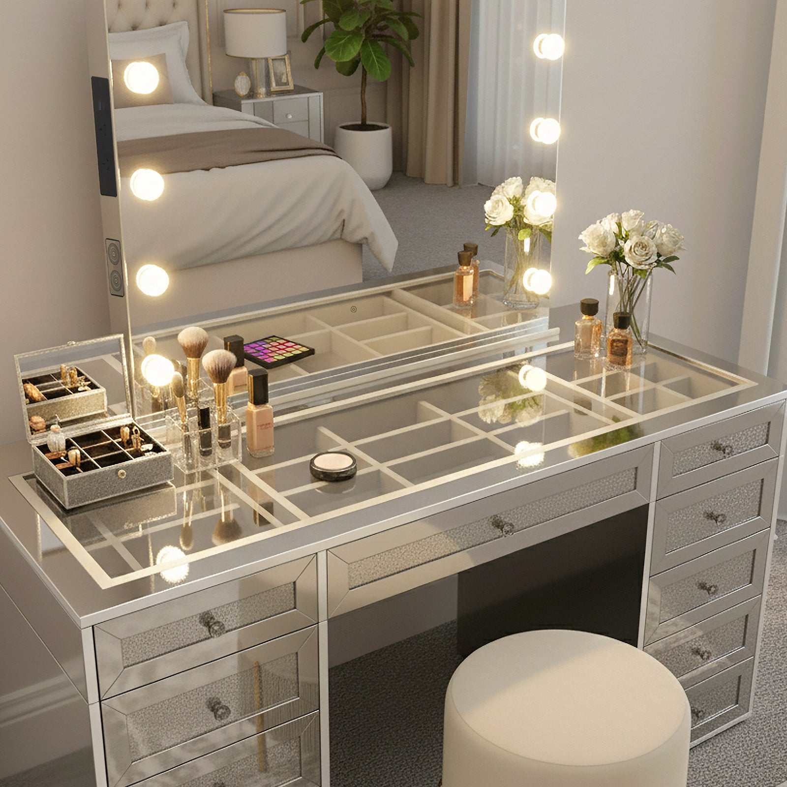 Ivy Diamond Crystal Mirror Finish Hollywood LED Vanity Table features a mirrored design, LED bulb-framed mirror, glass-topped dresser, cushioned stool, and organized beauty items, enhancing your glam routine.