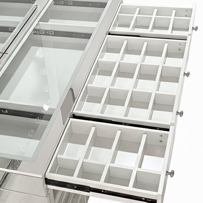 Interior of the Ivy Diamond Hollywood Vanity Table in Silver, showcasing two pull-out drawers with grid dividers under a glass top for organized storage of beauty essentials.