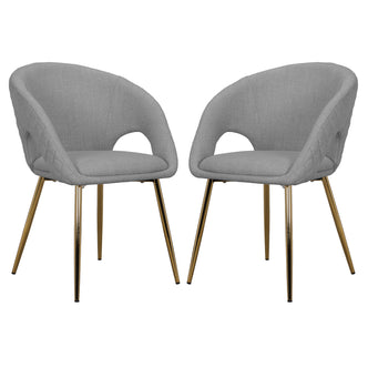 Jazlyn Fabric Dining Chairs with Gold Legs Set of 2 in Grey, featuring curved upholstered shells with cut-outs at arm-backrest junction, supported by slender gold-tone metal legs, offering modern elegance.