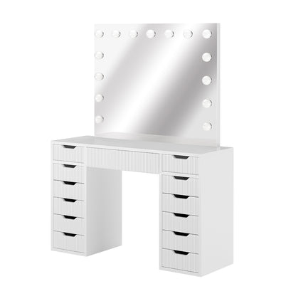 Jenna LED Mirror Dressing Table - Fluted White: Sleek white desk with multiple drawers and a large mirror framed by 13 LED bulbs, ideal for organized beauty and makeup application.