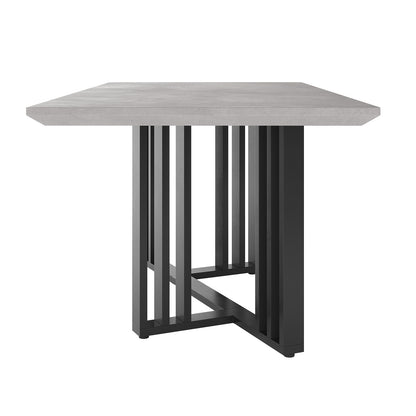 Joel 180cm 4-6 Seater Modern Dining Table in Concrete featuring a light-gray smooth top on a black metal base with geometric slats, perfect for contemporary industrial-style décor.