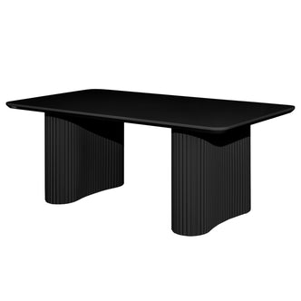Joyce 120cm Coffee Table with Round Fluted Legs in Black features a matte-black rectangular top with rounded corners, supported by sculptural, fluted pedestal bases, creating a bold, modern centerpiece.