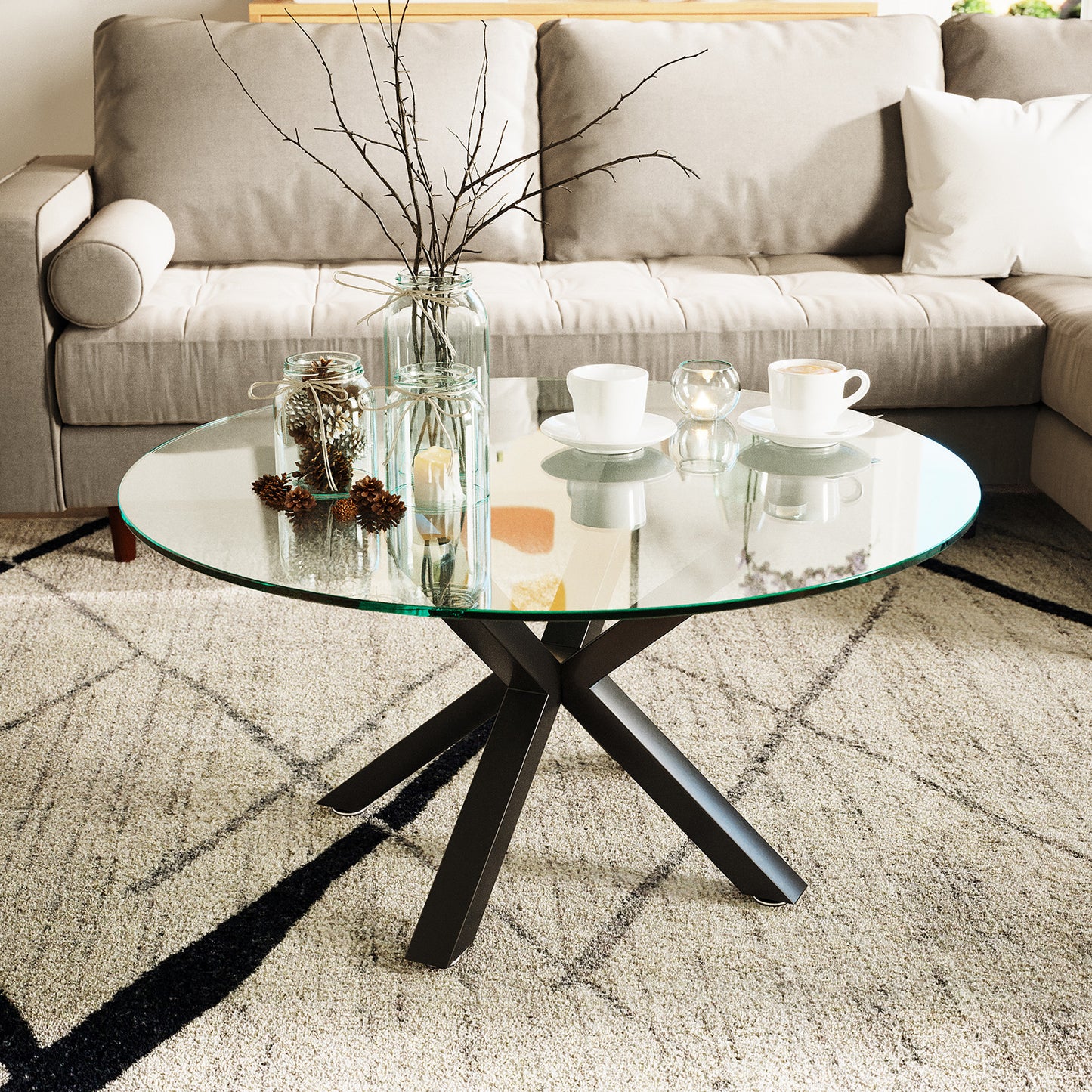 Kansas 80cm Round Glass Coffee Table Black shown in a living room setting, highlighting its transparent glass top and sleek metal frame, perfect for modern interiors.