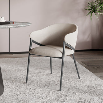 Karin Linen Fabric Dining Chair Set of 2 - Beige, showcasing plush foam cushioning, rounded arms, and a curved backrest, all supported by a powder-coated black metal frame for a stylish, modern look.