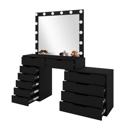 Lassie Hollywood Vanity Dressing Table with Drawers in Black features a large mirror framed with LED bulbs, two shallow drawers, and side drawer stacks. Assorted makeup brushes rest on the tabletop.