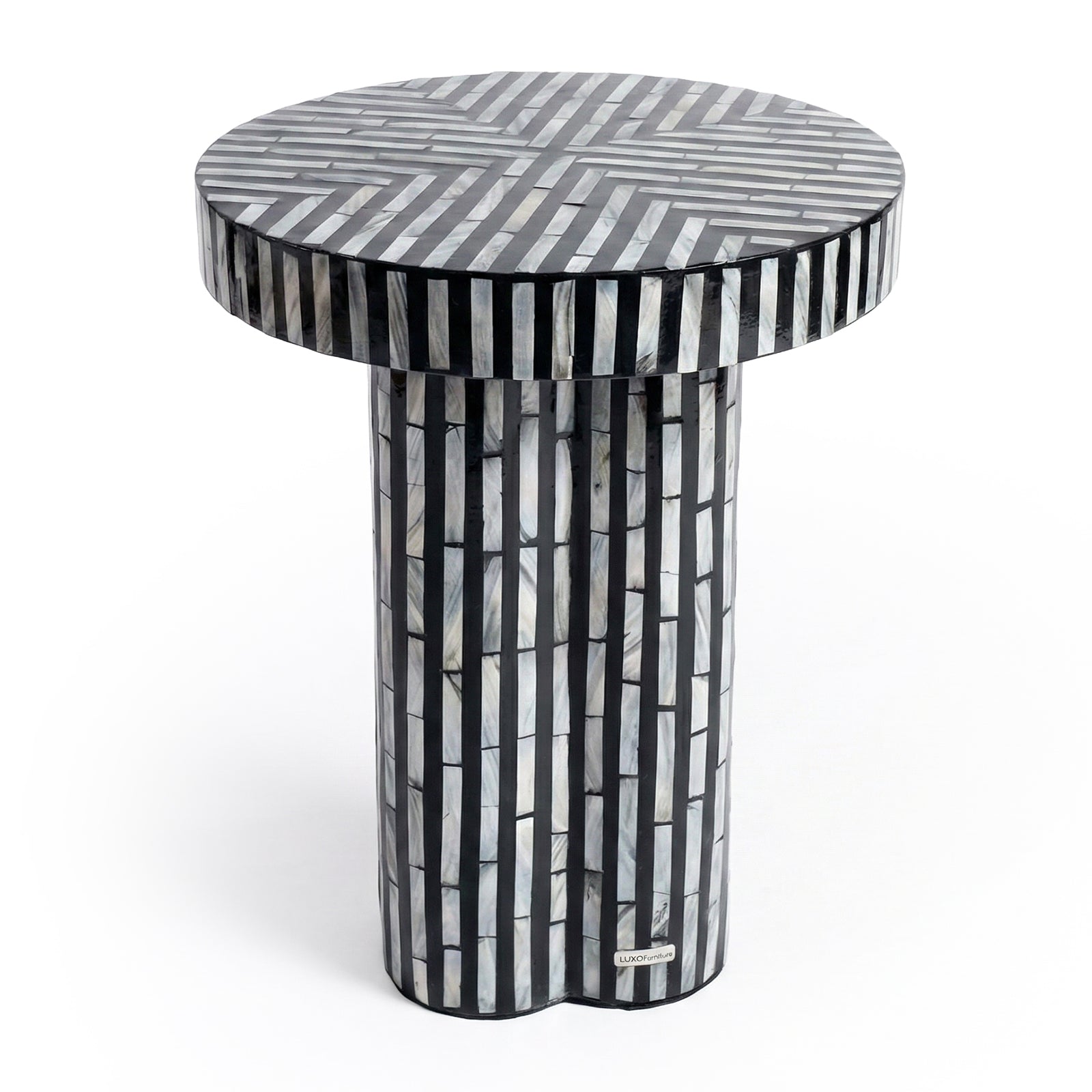 Round side table with black and gray geometric pattern on white background