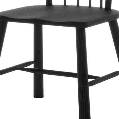 Close-up of the Leigh Solid Oak High-back Dining Chair Black Set of 2, highlighting the sturdy spindle back supports, sleek black wooden seat, and robust legs with connecting stretchers for durability and style.