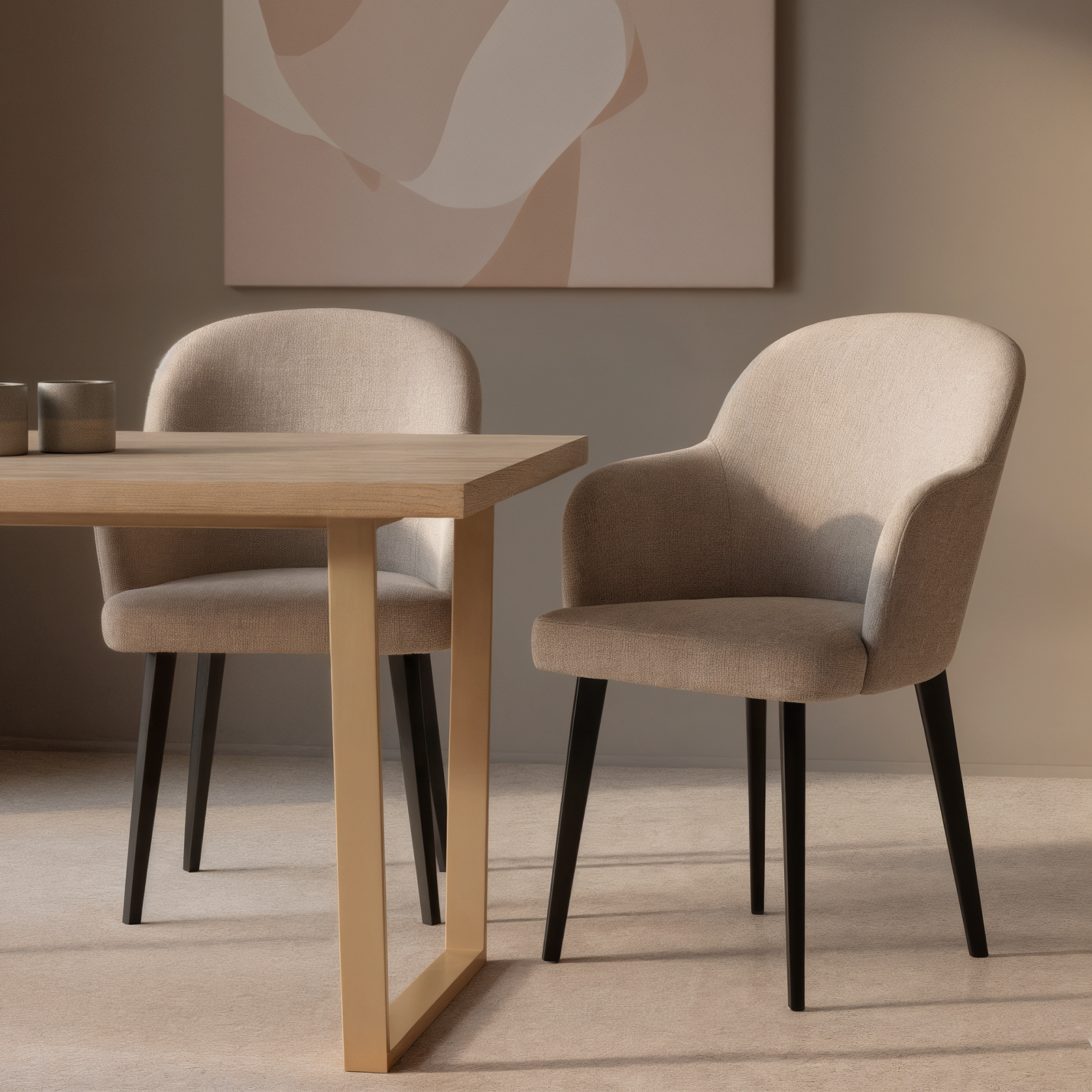 Lennon Linen Fabric Dining Chair Set of 2 in Beige features elegant upholstered armchairs with curved backs and slender black legs, enhancing a minimalist dining nook with soft, neutral tones.