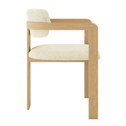 Maddi Boucle Hardwood Dining Chair features a curved backrest and thick cushions in boucle fabric, showcasing a modern armchair style with ergonomic design and solid American wood frame.