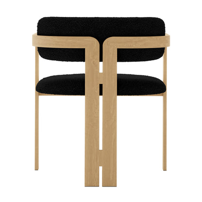 Maddi Boucle Hardwood Dining Chair Black: Close-up of the chair's black boucle fabric, curved backrest, and wooden legs, highlighting its stylish and ergonomic design made from solid American wood.