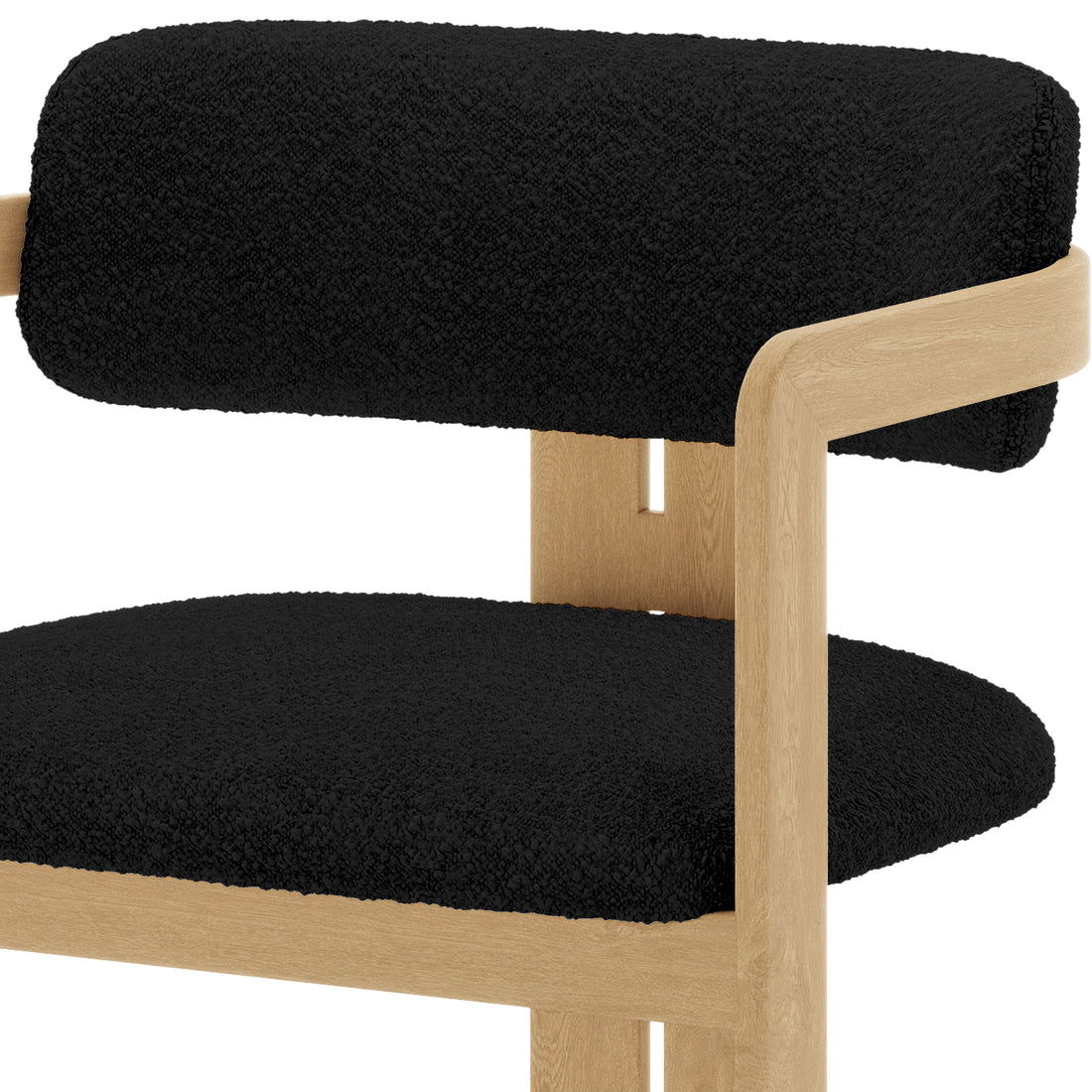 Maddi Boucle Hardwood Dining Chair Black with a wooden frame, featuring a curved backrest and a plush black cushion, showcasing its stylish and ergonomic design for comfort and durability.