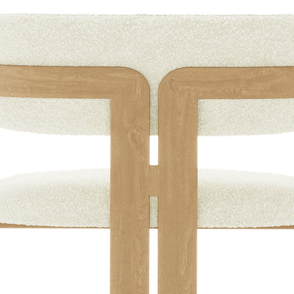 Maddi Boucle Hardwood Dining Chair Cream White features a curved backrest, plush boucle upholstery, and sturdy wooden frame, highlighting its elegant design and ergonomic comfort for stylish dining spaces.