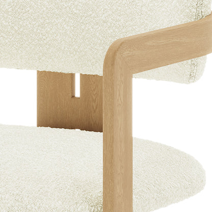 Close-up of the Maddi Boucle Hardwood Dining Chair in Cream White, showcasing its textured boucle upholstery, ergonomic curved backrest, and sturdy American wood frame, highlighting its stylish and durable design.