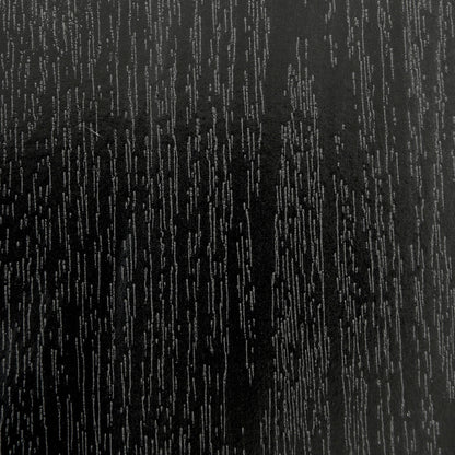 Close-up of Mae 220cm 8 Seater Rectangular Dining Table in Black, showcasing its wood-grain textured surface with lighter lines, resembling a sleek, refined, and modern tabletop design.