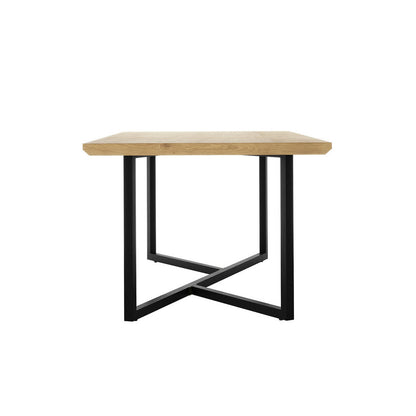 Mae 220cm 8 Seater Rectangular Dining Table in Natural features a light wood rectangular top with a black metal base forming an “X” pattern, embodying modern elegance and industrial charm.