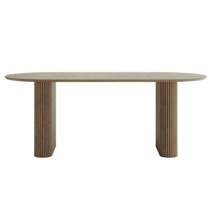 Marciana 8 Seater Fluted Oval Dining Table featuring a racetrack-shaped tabletop in light wood with sculptural fluted cylindrical pedestal legs, blending modern design with functionality for spacious dining.