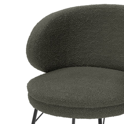 Meily Boucle Dining Chair Set of 2 in Green features a round seat with textured bouclé upholstery, crescent backrest, and slender metal legs, showcasing modern design and comfort.