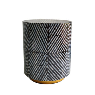 Merry 35cm Mother of Pearl Inlay Side Table in Ivory & Black, featuring a cylindrical design with a striking black-and-white herringbone mosaic and a low, gold-colored base.
