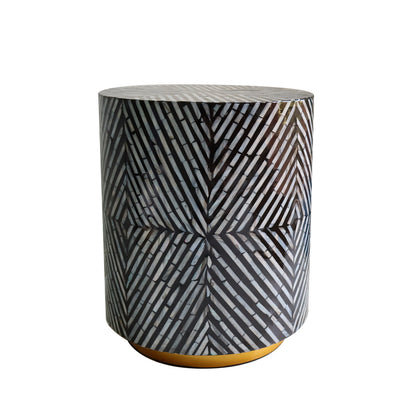 Merry 35cm Mother of Pearl Inlay Side Table in Ivory & Black, featuring a cylindrical design with a striking black-and-white herringbone mosaic and a low, gold-colored base.