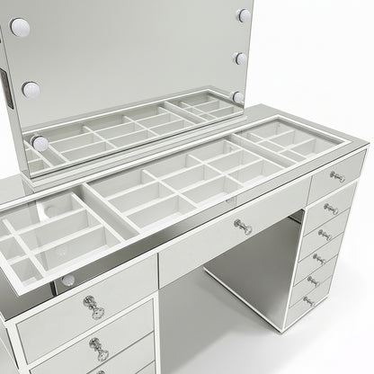 Monroe Hollywood Makeup Dressing Table in Silver featuring a large LED bulb mirror, glass surface with dividers, and crystal-knob drawers, offering organized storage and integrated power options for a luxe, functional vanity experience.
