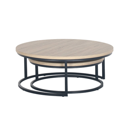 Nevada Round Nesting Coffee Table Set in Natural, featuring two round tables with light-wood veneer tops and slender black metal frames, designed for space-saving elegance in contemporary living rooms.