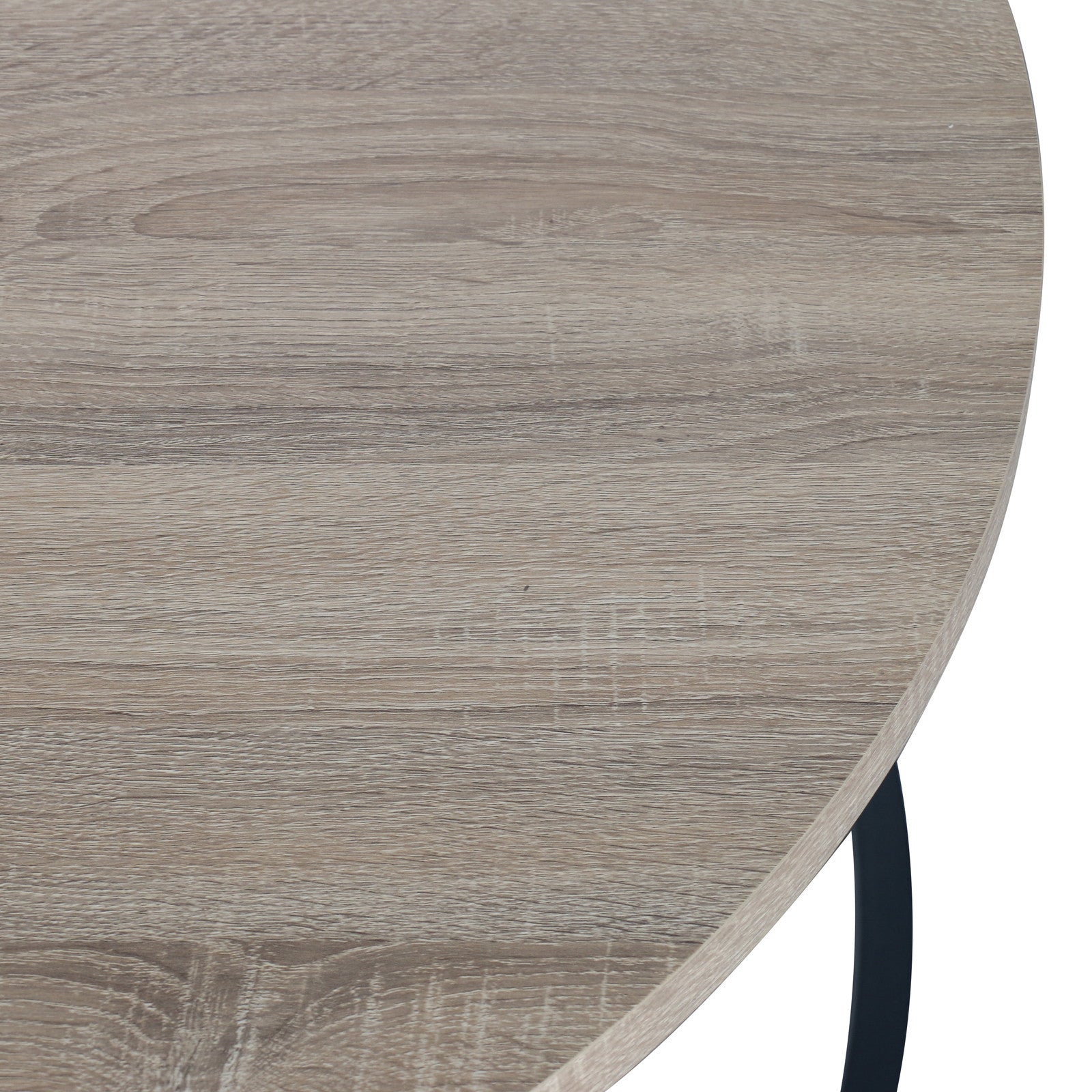 Close-up of the Nevada Round Nesting Coffee Table Set in Natural, showcasing a light, weathered-oak wood-grain tabletop with a visible black metal leg, emphasizing its modern design and space-saving functionality.