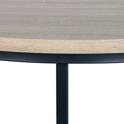 Close-up of Nevada Round Nesting Coffee Table Set in Natural, featuring a light wood tabletop with a slim black metal apron and square leg, perfect for space-saving and stylish living room arrangements.