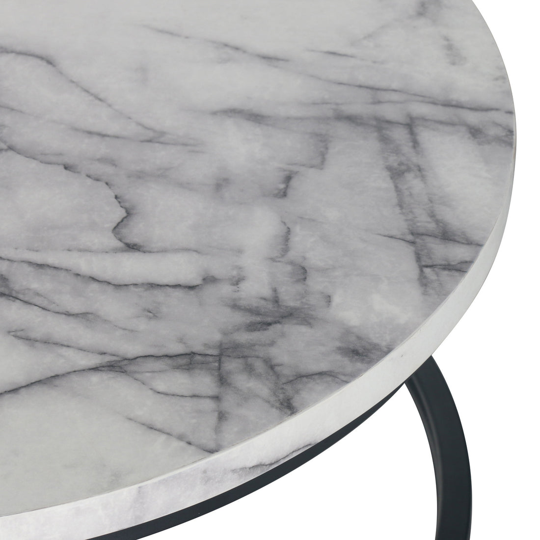 Close-up of the Nevada Round Nesting Coffee Table Set in White Marble, highlighting the white marble tabletop with natural gray veining, supported by a slim, dark metal frame.