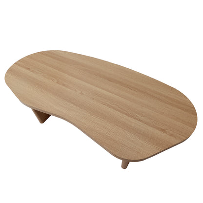 Nicole 120cm Oval Coffee Table in Natural, featuring a light wood-grain finish, organic kidney-bean shape top, and three stout, tapered legs, offers a minimalist and sculptural design.