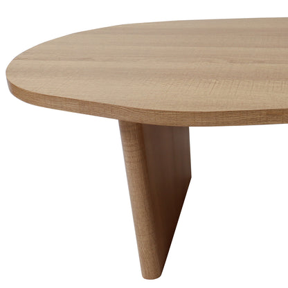 Edge view of Nicole 120cm Oval Coffee Table in Natural, showcasing its light-wood tabletop and a tapered, conical leg, highlighting the table's organic curves and minimalist design.