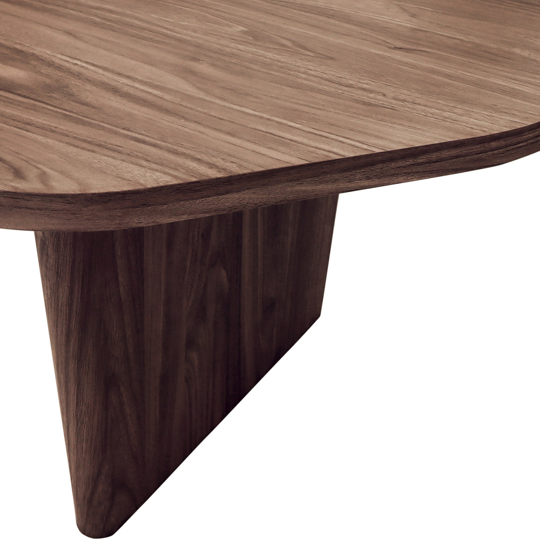 Nicole 120cm Coffee Table with Organic Curve in Walnut, showcasing a sculptural wooden tabletop with a smooth edge and matching triangular pedestal, embodying modern elegance and timeless design.