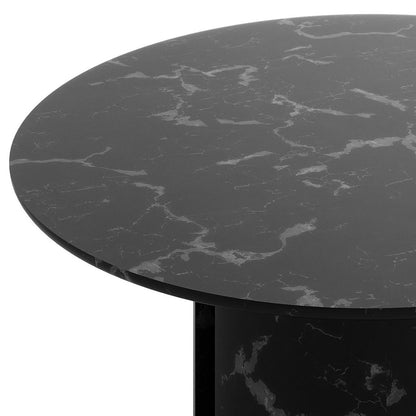 Close-up of the Nydia 120cm Round Dining Table - Black, showcasing its dark faux-marble top with gray veining and curved profile, highlighting the sophisticated Crystal Marbling finish.