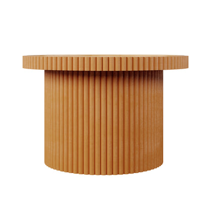 The Nylah Natural Rattan Centre Coffee Table in Honey features a round, wooden tabletop and a fluted-column base, showcasing vertical grooves and a warm, light brown finish against a plain white background.