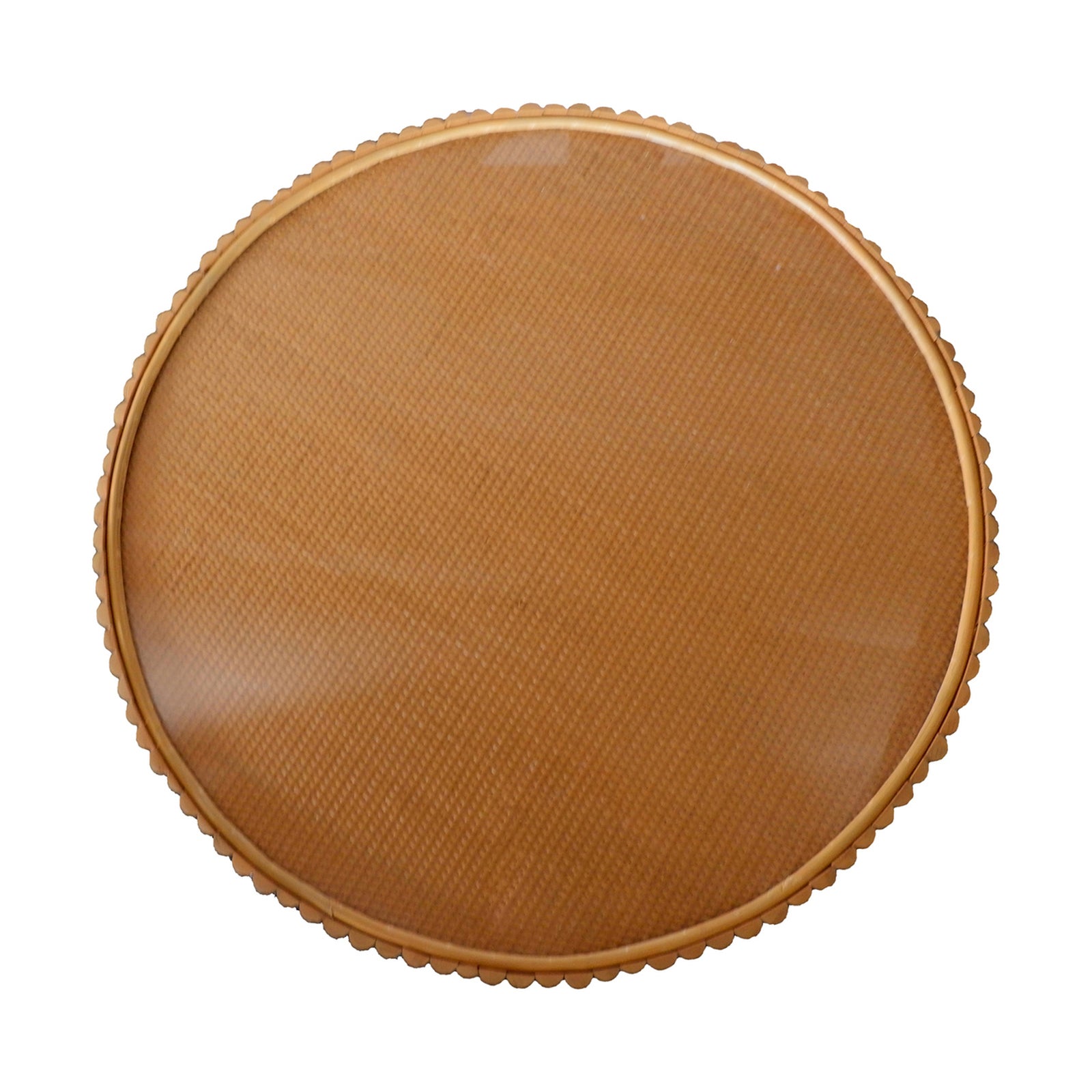 Nylah Natural Rattan Centre Coffee Table in Honey, featuring a round, tan-coloured plastic disc with a fine cross-hatch texture and scalloped border, resembling a decorative lid or trivet.