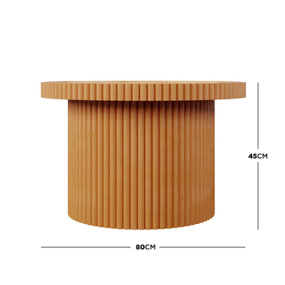Nylah Natural Rattan Centre Coffee Table in Honey features a ribbed, textured design with vertical flutes on its round wood base and top, measuring 80 cm in diameter and 45 cm high.