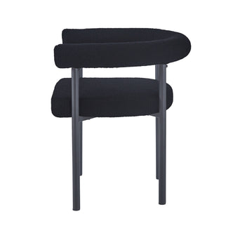Ohio Curved Boucle Dining Chair Set of 2 in Black features plush boucle upholstery, curved backrest, and sleek tubular metal legs, emphasizing modern style and comfort for dining or casual spaces.